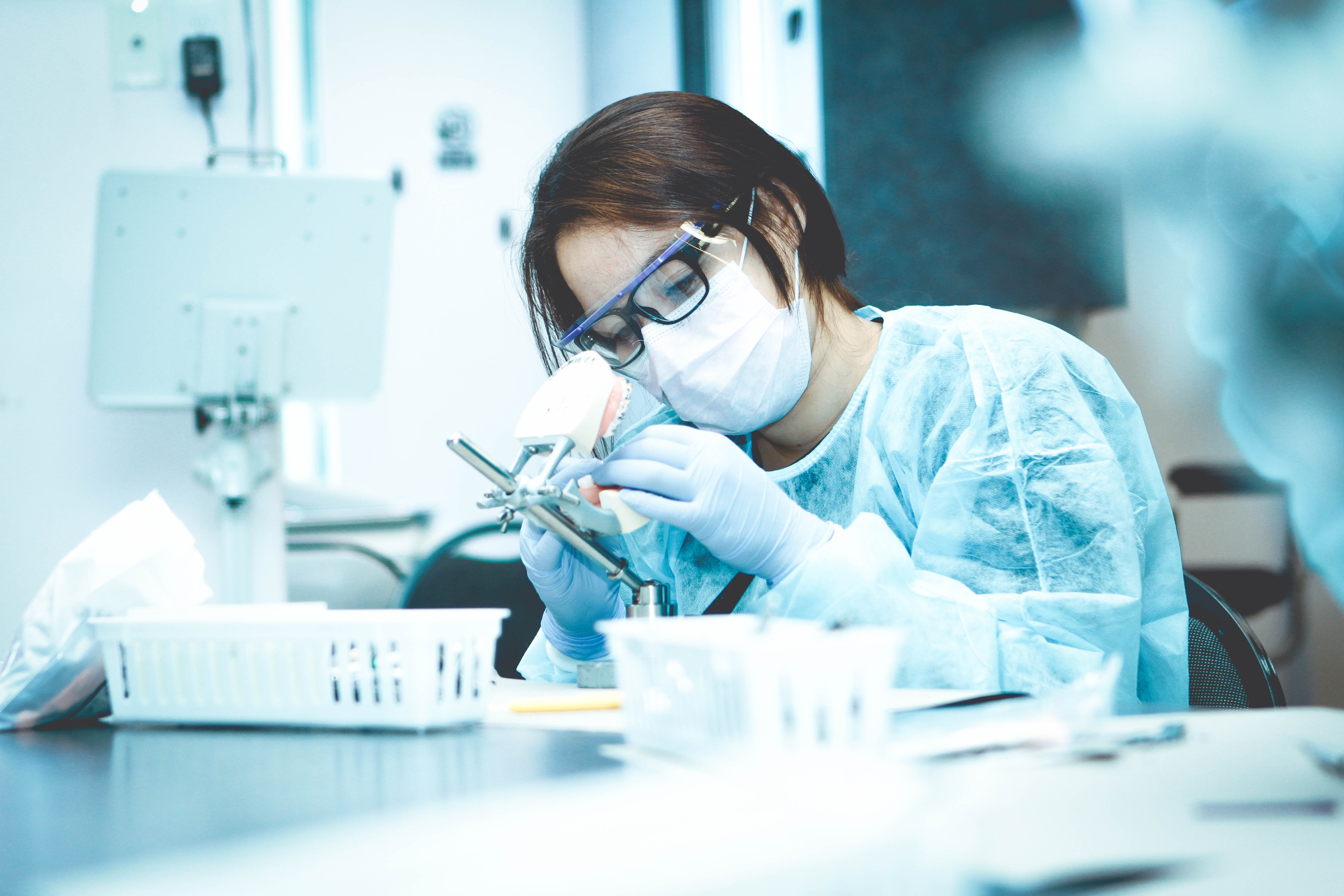 dental assisting student working